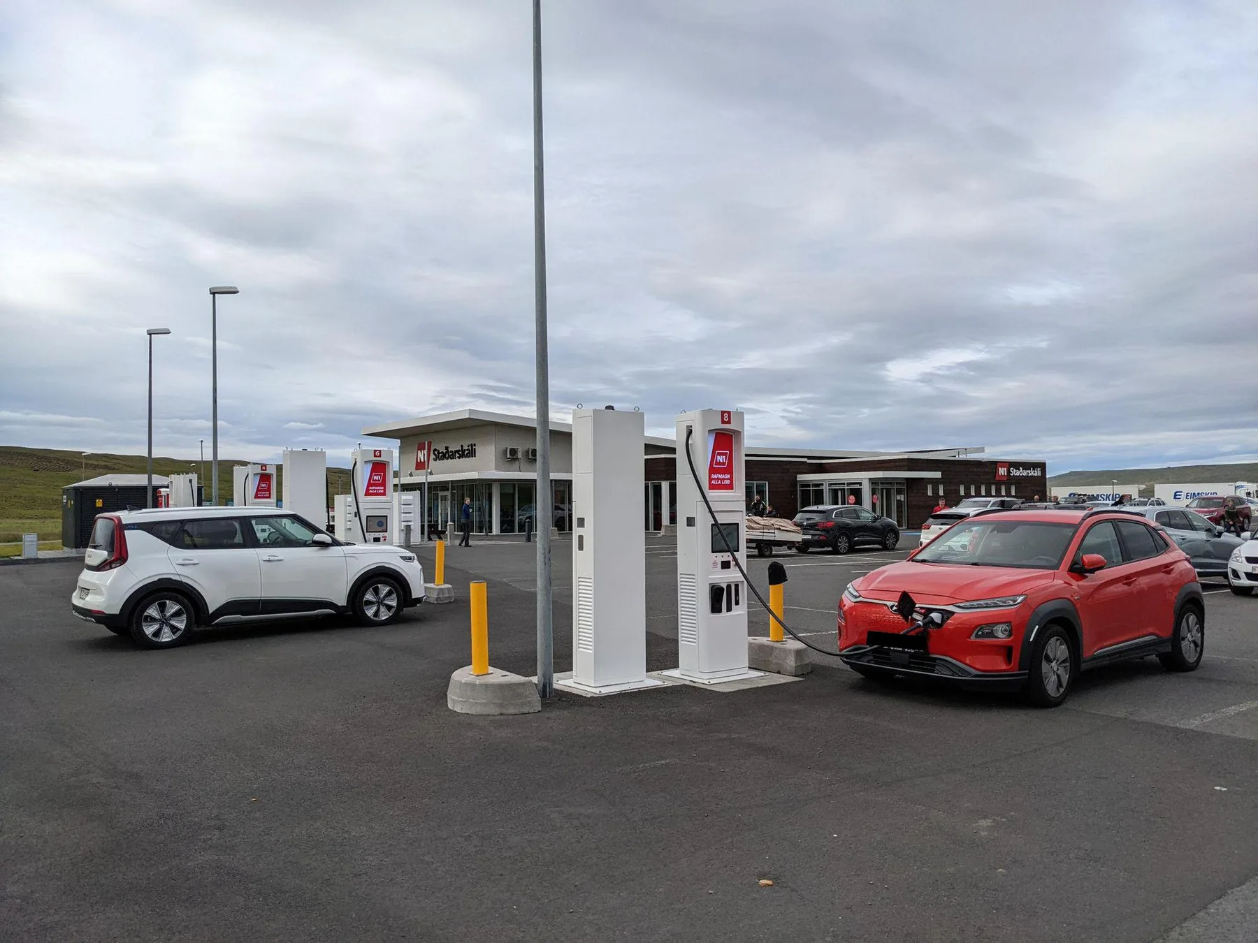 N1 service station and electric-vehicle charging bays at Staðarskáli, Iceland; shown to explain in-car charging and journey planning, not to represent hotel sockets, same-day availability or a particular rental-car class