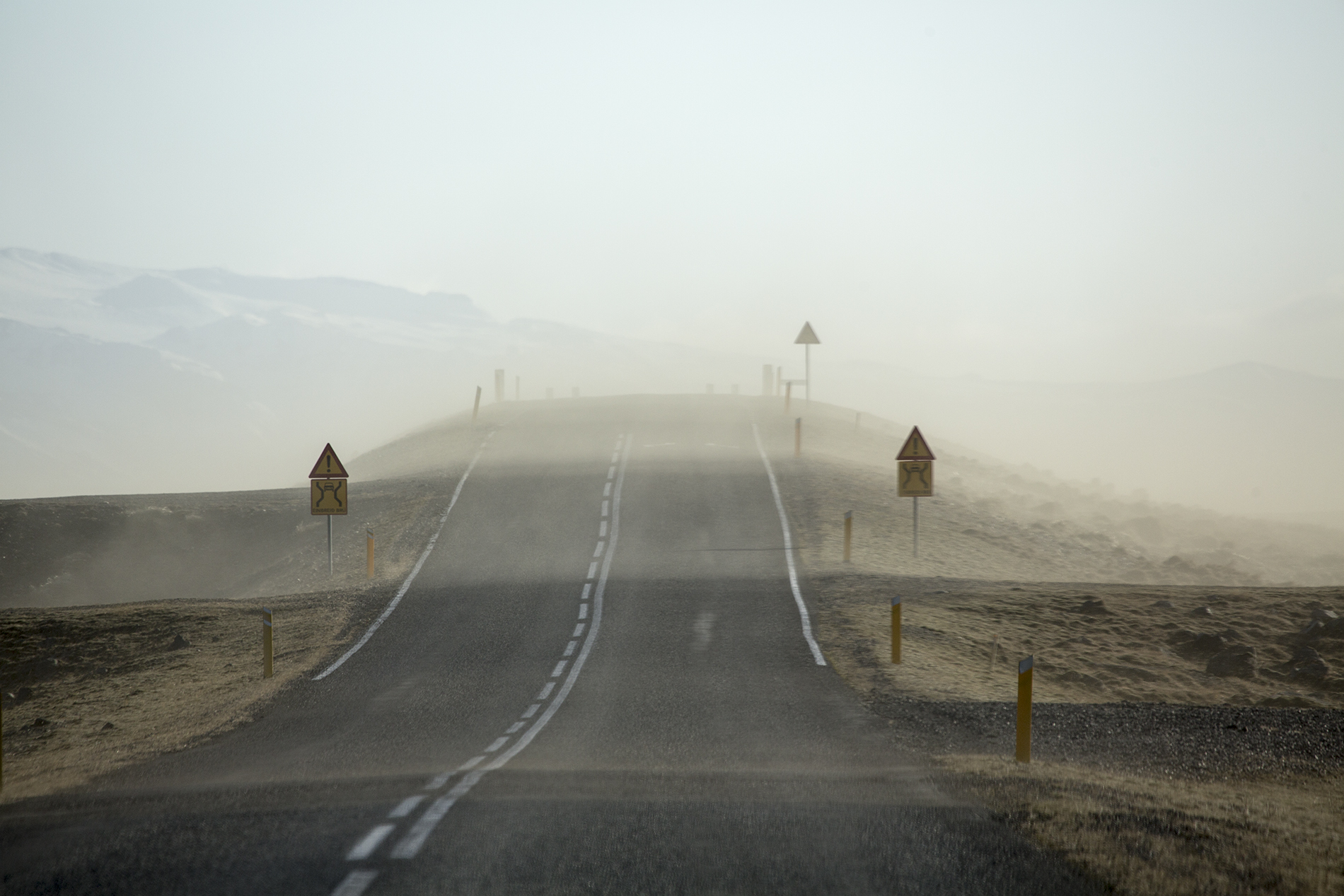 Blowing sand affecting visibility on an Iceland road