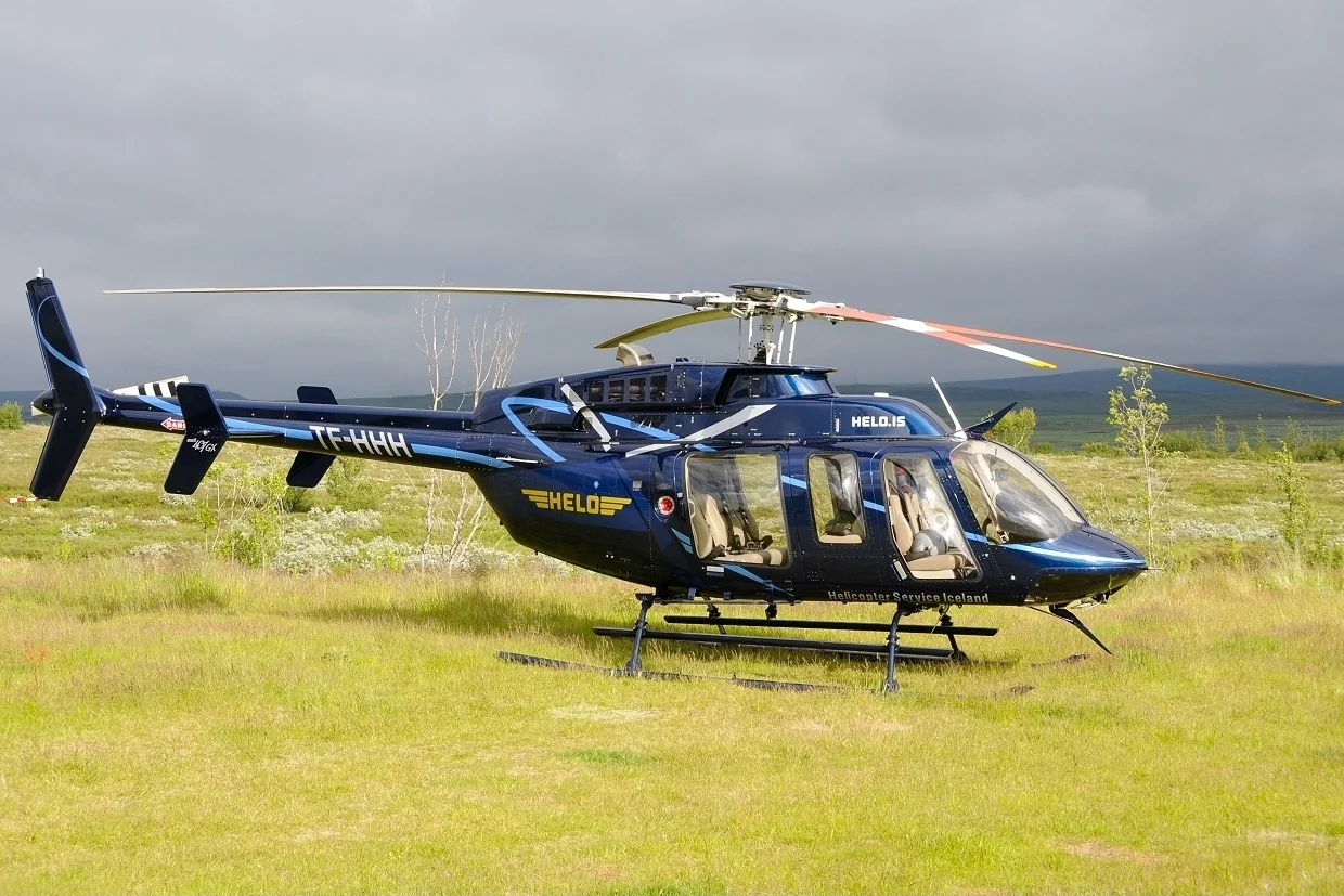 A Bell 407GX helicopter over Iceland’s Haukadalur valley