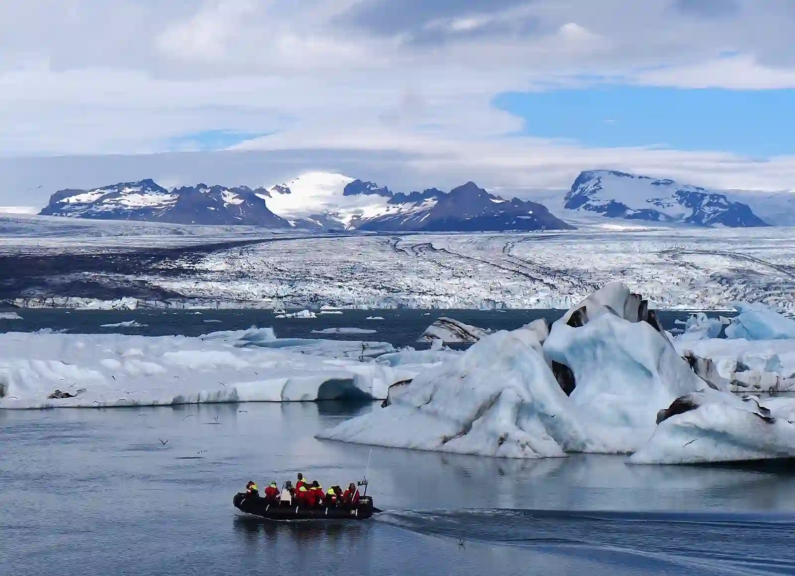 A Zodiac boat and icebergs on Jökulsárlón glacier lagoon