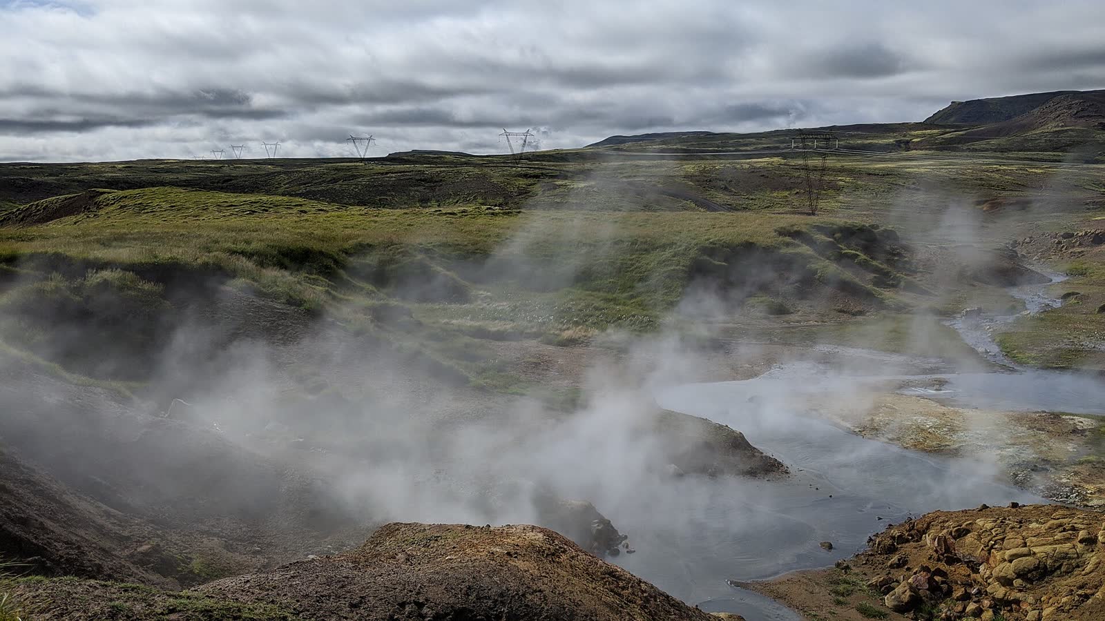 The steaming geothermal valley at Reykjadalur; conditions shown do not represent water temperature, trail conditions or access on your departure date