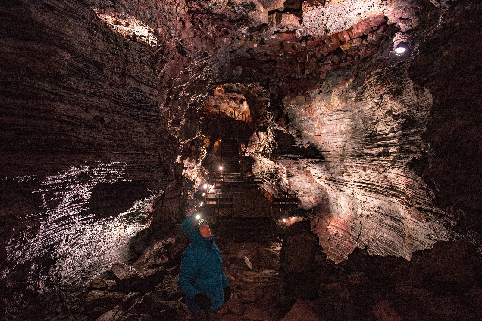 Rock walls, ceiling and a walkway inside Raufarhólshellir lava tunnel