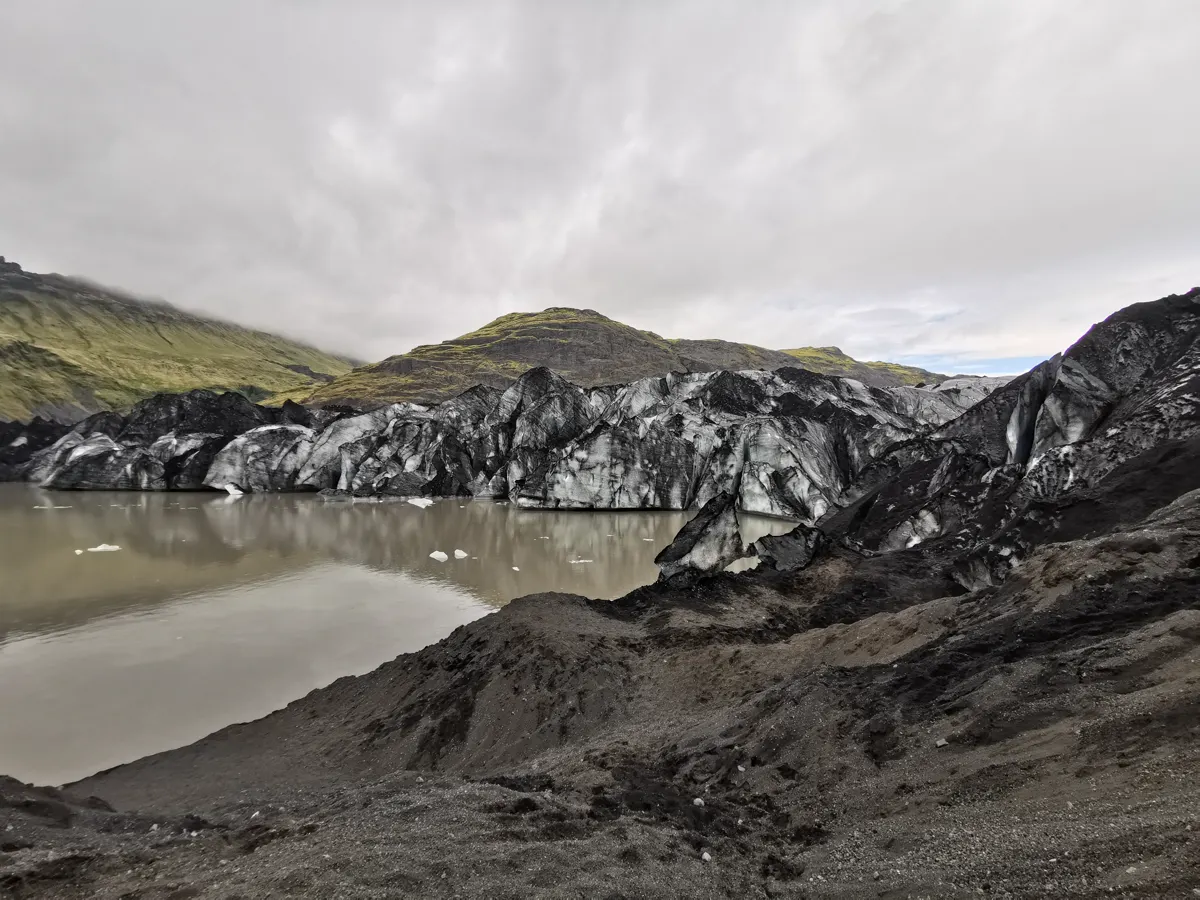 The edge of Sólheimajökull and its dark glacial landscape