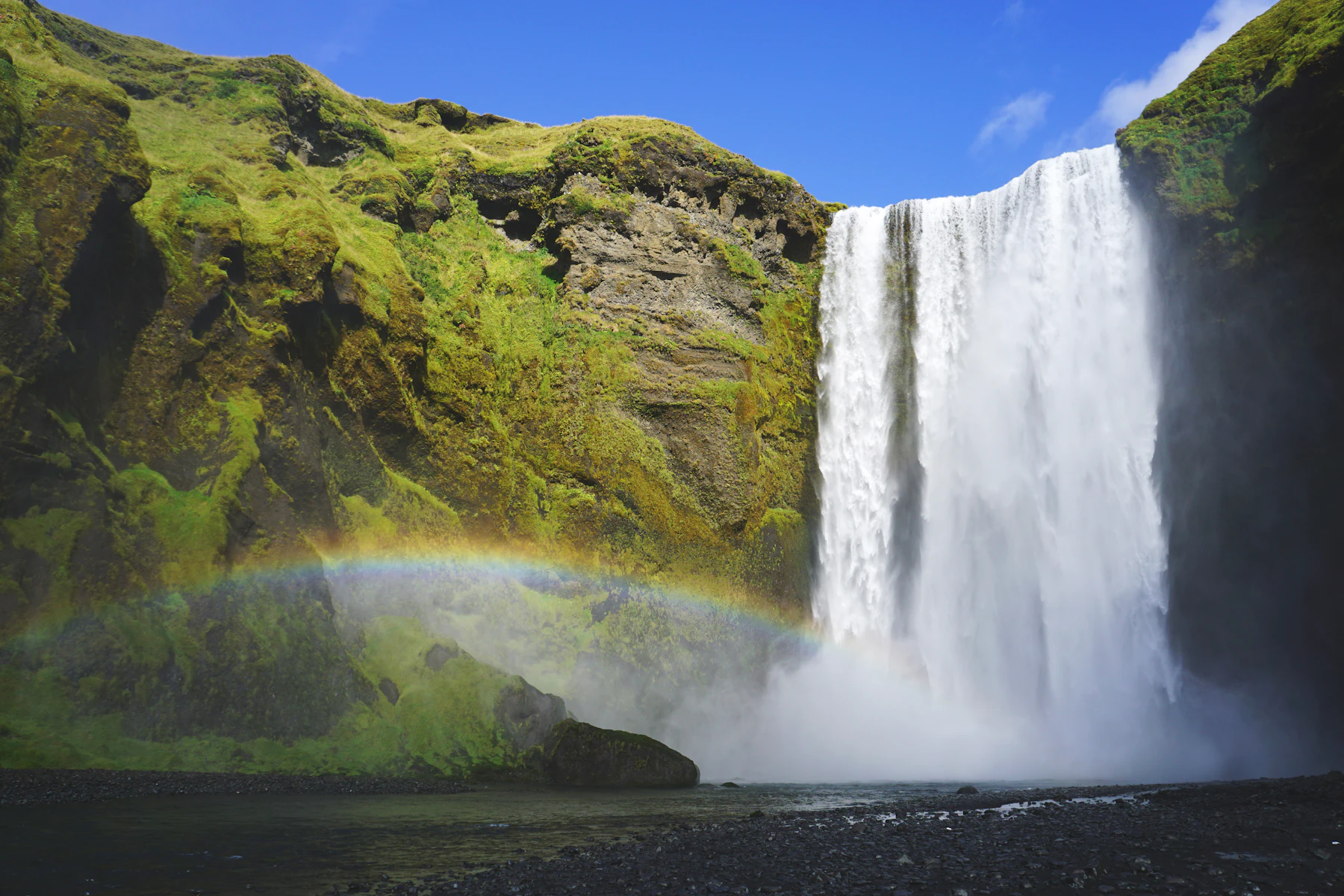 Skógafoss on Iceland's South Coast with a rainbow in front of the falls